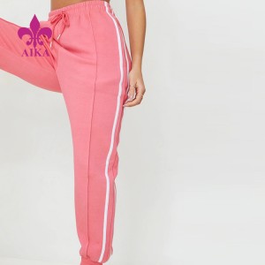 Nieuwe trendy aangepaste logo katoen polyester snoep roze dubbele zijstreep trekkoord taille dames joggers