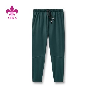 Prezzo di fabbrica Pantaloni da jogging da palestra slim fit in nylon con logo personalizzato leggero all'ingrosso per uomo