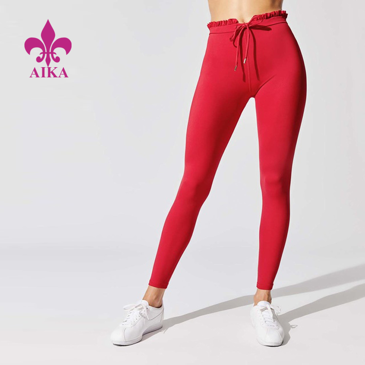 OEM üreticisi Yoga Kıyafetleri Üreticisi - Kadınlar için iyi fiyatlı şık ve gündelik tayt büzme ipi ve fırfır kenarlı yoga egzersiz aktif giyim taytı - AIKA