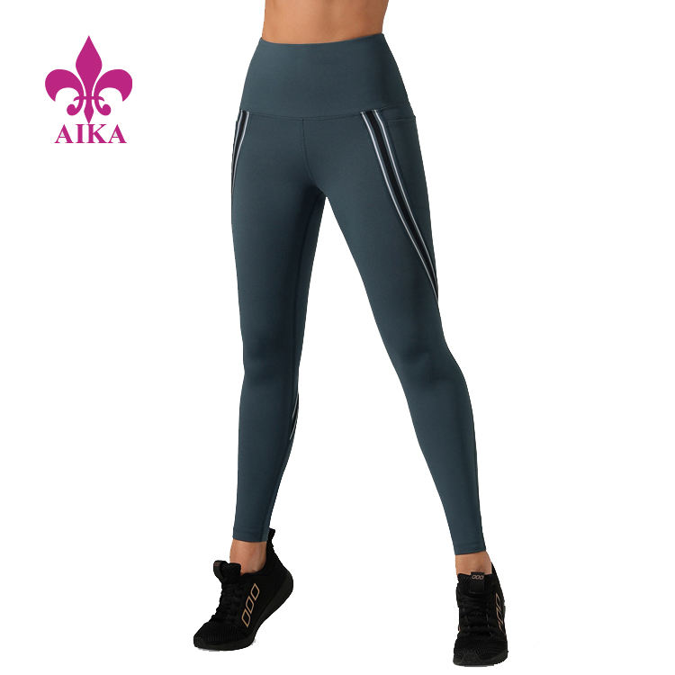Proveedor de polainas al por mayor - Polainas de yoga de compresión para mujer con bolsillos laterales a rayas de nuevo diseño de moda - AIKA