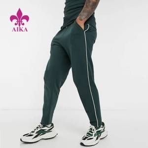 Чоловіче спортивне спорядження для бігу, зелені спортивні штани з суцільним кольором з боковою смужкою з логотипом