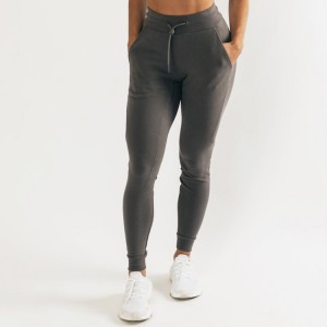 Pantalóns deportivos de pernera cónica OEM por xunto Pantalóns deportivos slim fit de algodón para mulleres