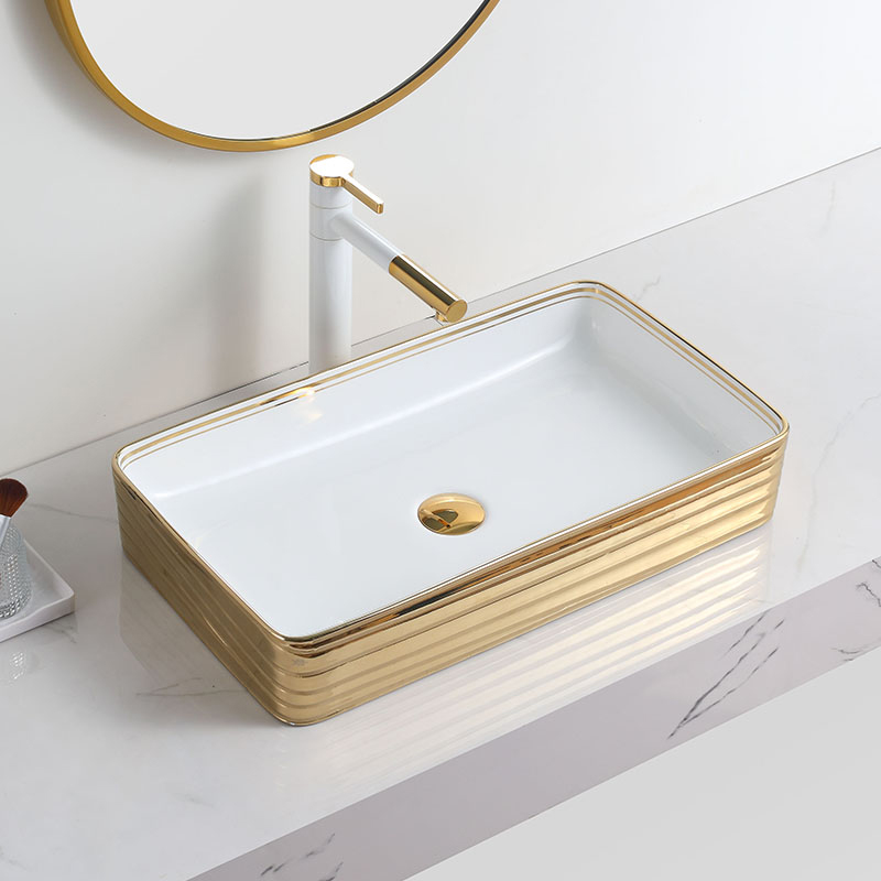Luxus-Keramik-Waschbecken mit rechteckigem Kunstbecken und Goldrand