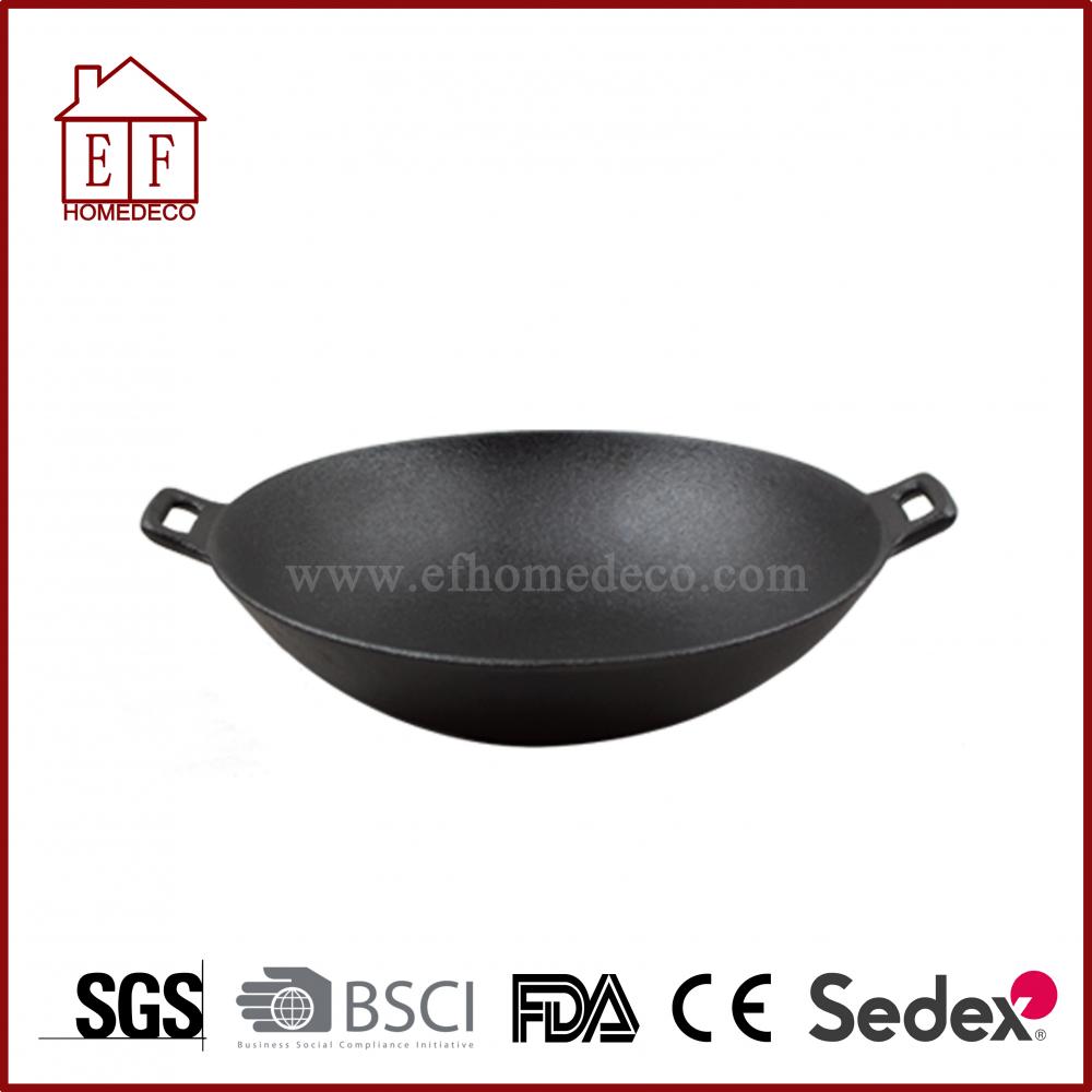 Cast iron wok with solid handle