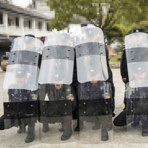 Anti riot shield with baton holder