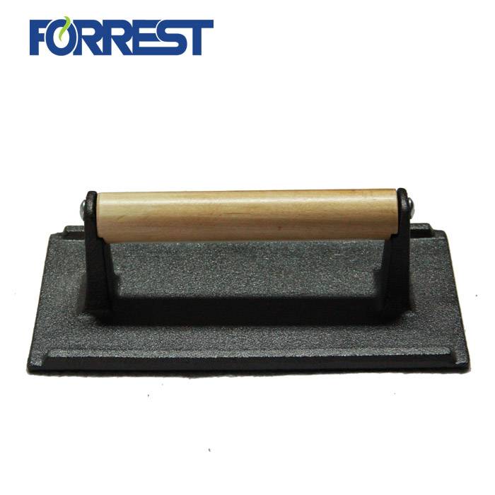 Premsa de graella de gran resistència Fons texturat Premsa de pes de bistec de ferro colat amb mànec de fusta