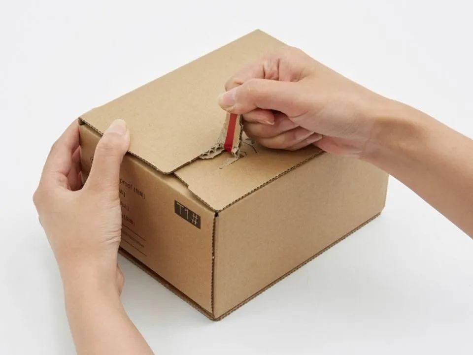 What are tear strips in cardboard packaging?