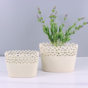 Keramička posuda za cvijeće i vaza izdubljenog oblika