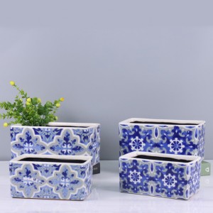 Macetero de cerámica con diseño chino y paleta de colores azules vibrantes