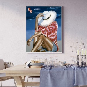 لوحة زيتية مؤطرة لامرأة على الشاطئ