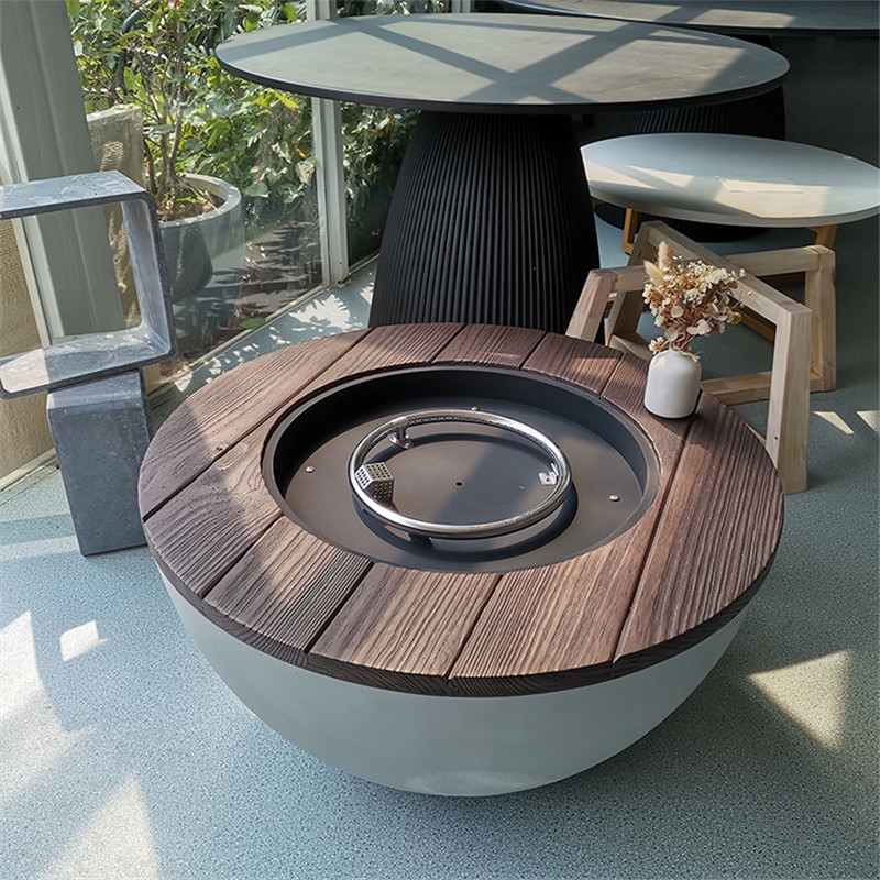 Pilkos medienos ovalios šildomos Kang stalo betoninės ugnies duobės lauko sodas, naudojamos gamtinės dujos, parduodamos Homedepot modeliui