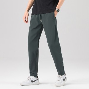 Pantalones deportivos tipo joggers de nanogrid de alta elasticidad para hombre con bolsillos