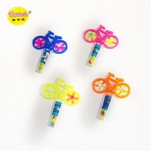 Giocattolo modello di bicicletta con ruote girevoli Faurecia con caramelle colorate