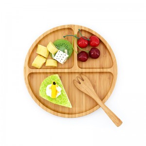 Le plateau alimentaire rond en bambou de cuisine peut contenir des salades et des desserts