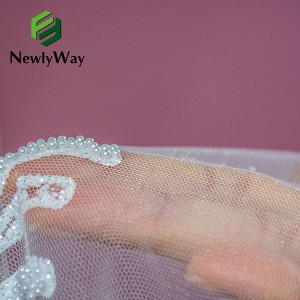 Καλύτερο σε πωλήσεις Όμορφο 100% φόρεμα Pyester Κεντητό μαργαριτάρια δαντέλα Λευκό νυφικό φανταχτερό περίγραμμα παγιέτες Glitter ύφασμα για γάμο