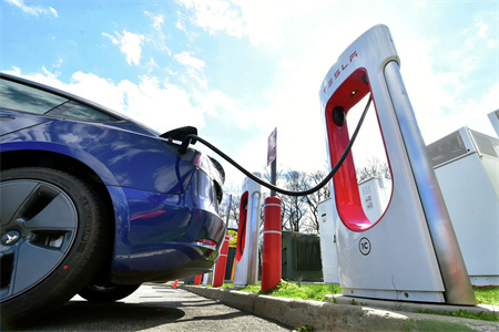 What is the difference between Tesla superchargers and other public chargers?