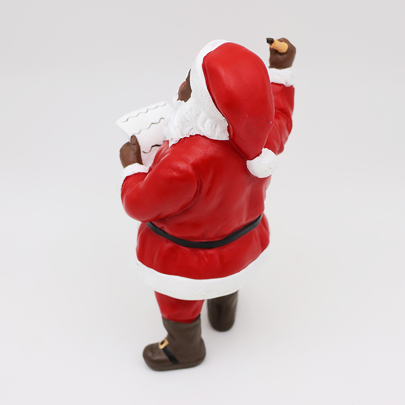 Dervos juodas Kalėdų Senelis su sąrašo kalėdine figūra