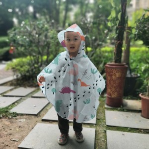 Ovida China တင်သွင်းသူ အထည် Raincoat ကြည်လင်ပြတ်သားသော ပုံနှိပ်ဒိုင်နိုဆော အရေးပေါ် မိုးတွင်းဝတ်နှင့် Unisex ကလေးများအတွက် Rain Poncho