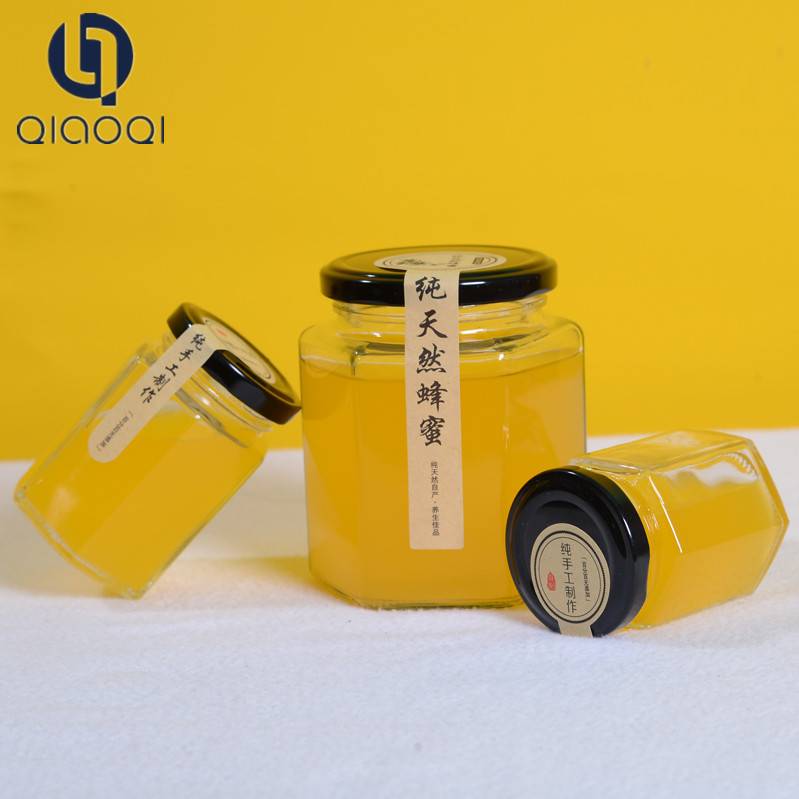 Hot sales glass customized bee honey bottle / glass jar