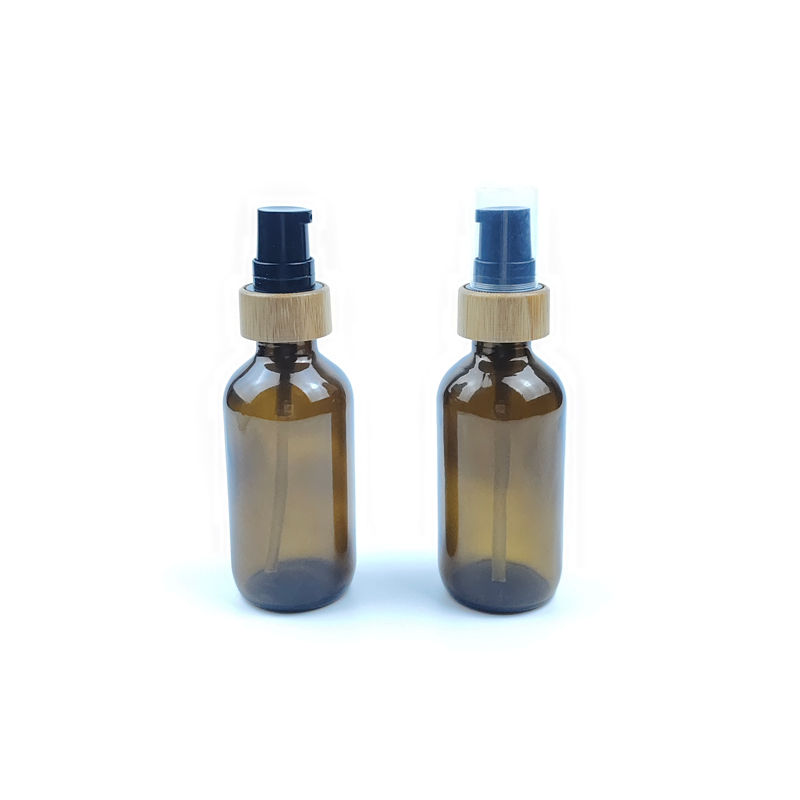RB-B-00339A confezione per la cura della pelle flaconi per la cosmetica rotondi di olio essenziale boston flacone in vetro ambrato da 2 once con pompa per il trattamento in bambù