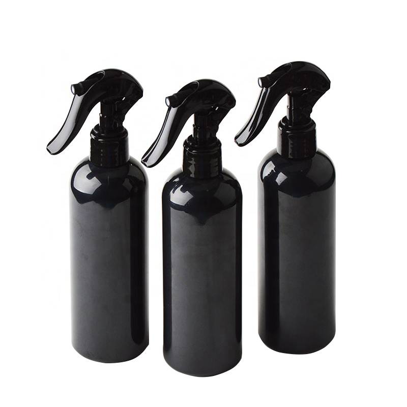 Botella de spray de plástico PET de forma redonda vacía negra con mini pulverizador de gatillo