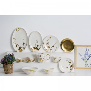 Namizna posoda iz belega porcelana v sodobnem slogu z motivom zlate nalepke