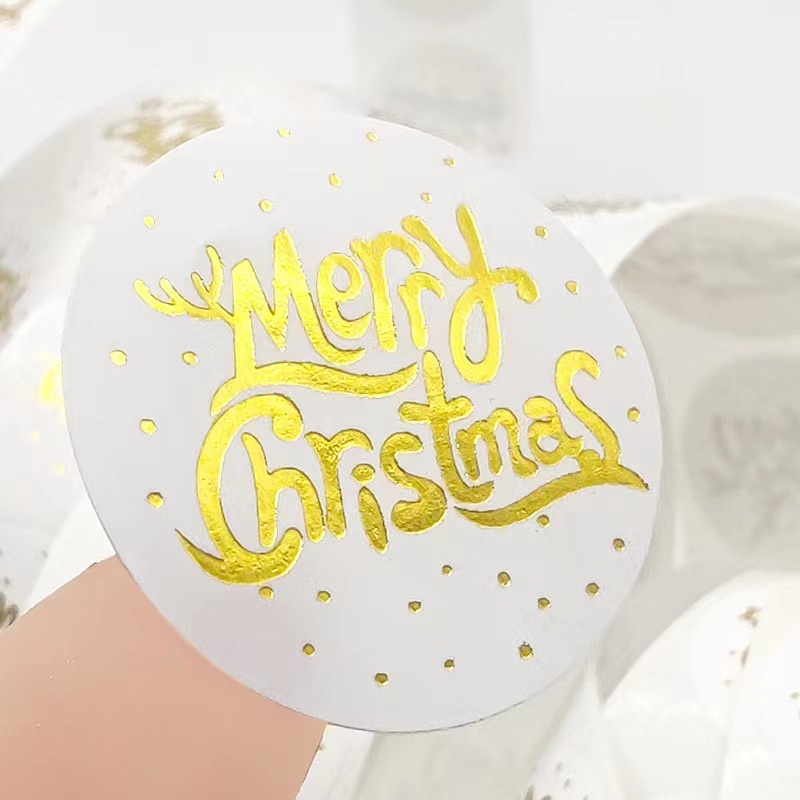 Fournisseur d'étiquettes imperméables en vinyle découpées avec des matrices d'impression personnalisée Autocollant adhésif rond de cylindre de logo d'or de joyeux Noël