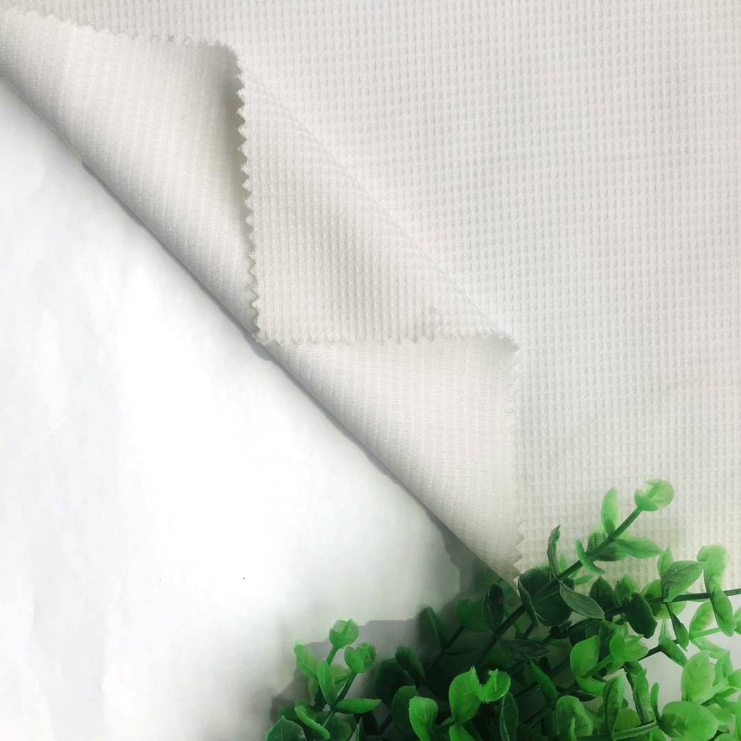 Praghas Monarcha Superior Quality Polyester Knit Waffle Fabraic le haghaidh Éadaigh