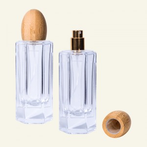 Okrugla staklena bočica parfema s ovalnim poklopcem od bambusa