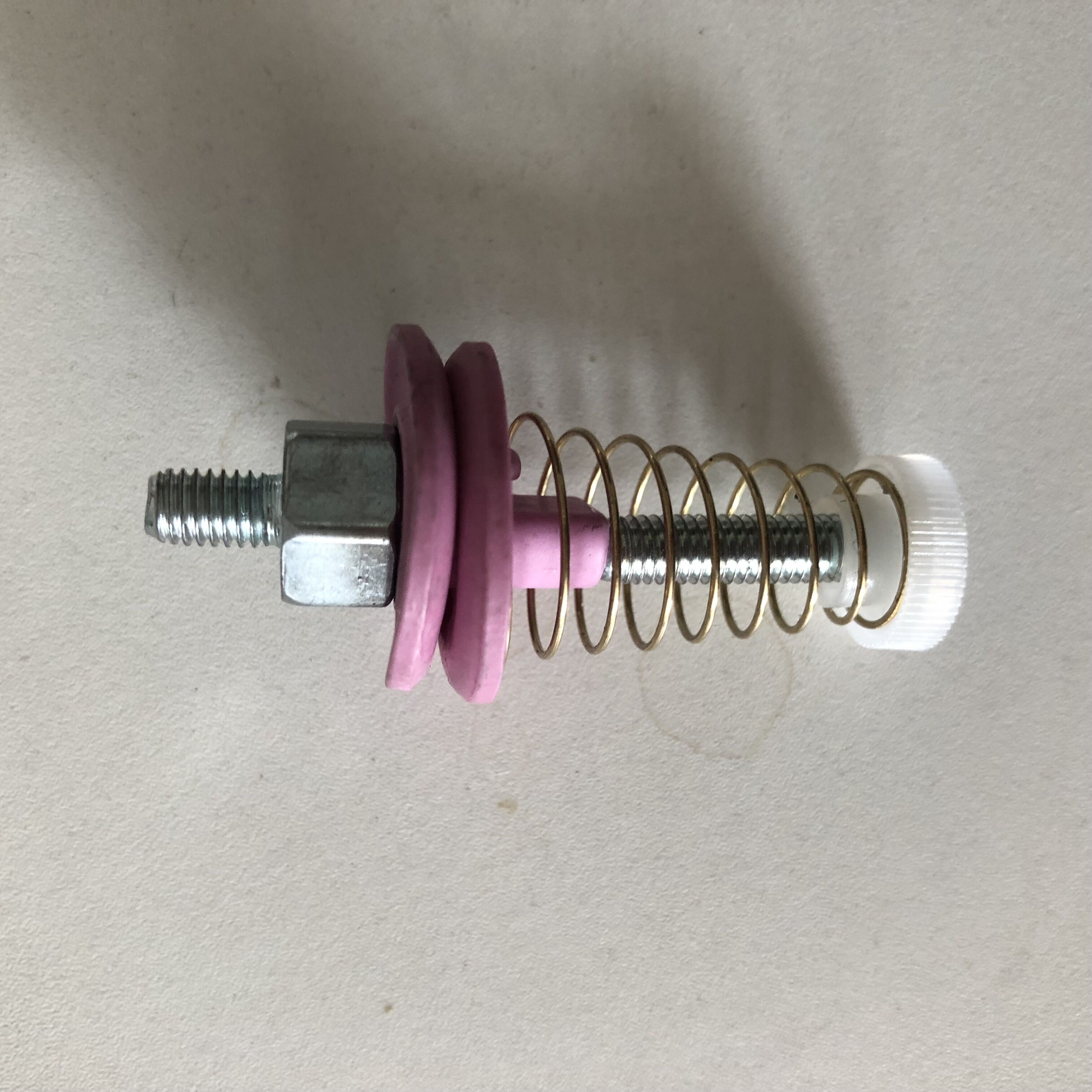tensioner for warping machinery parts
