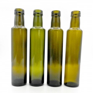 Круглая темно-зеленая бутылка оливкового масла емкостью 250 мл
