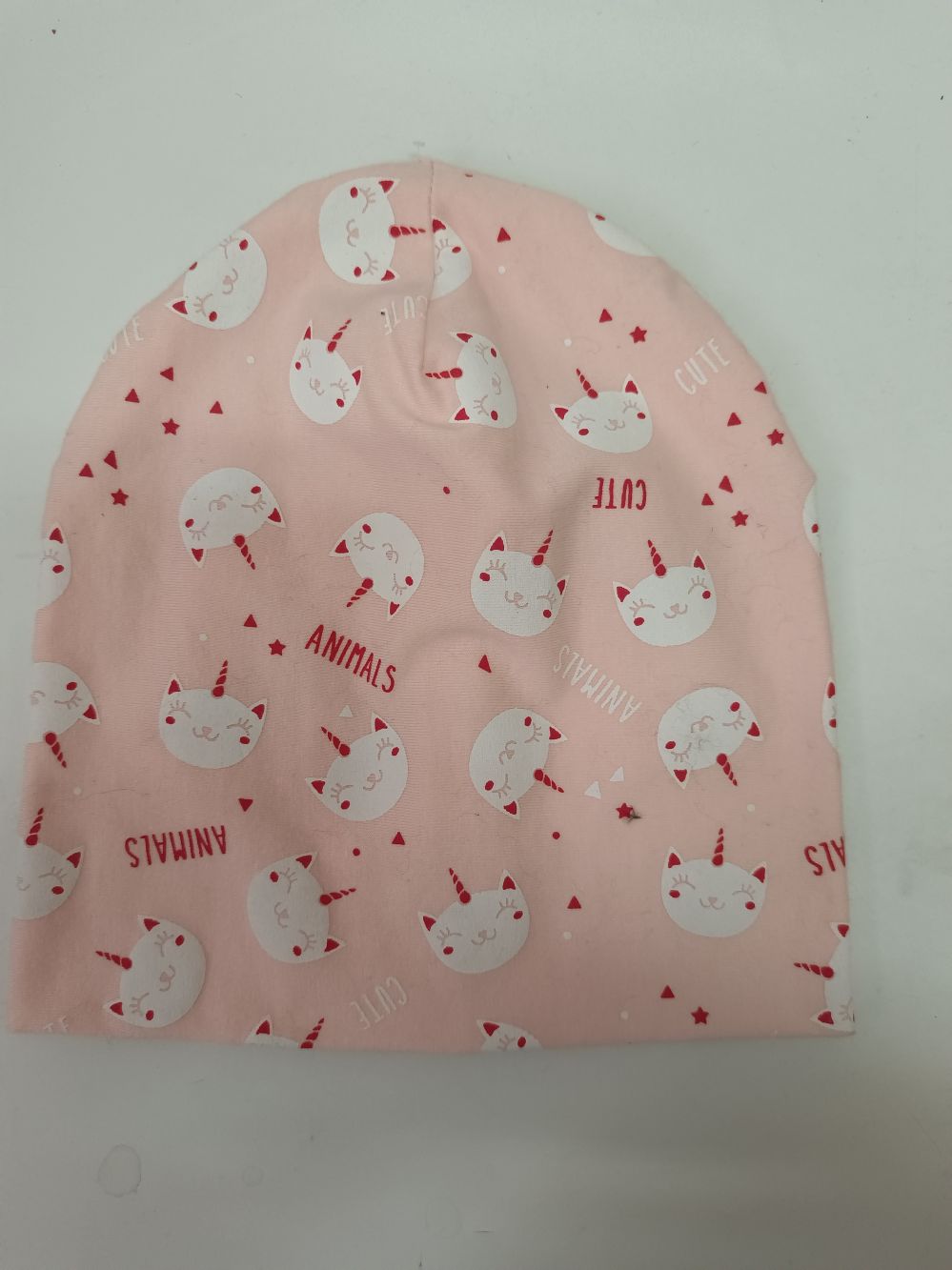 Beanie kain rajut allover motif hewan merah muda