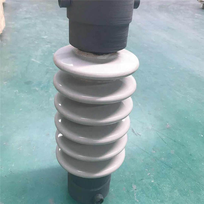 Ceramic shaft insulator for electrostatic precipitator