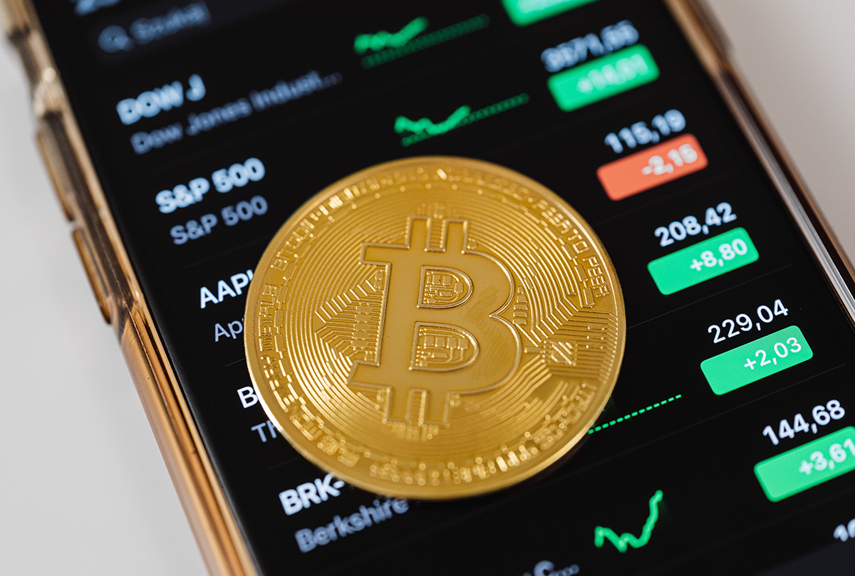 Rate Hike Drags Stocks Lower but Crypto Surges on Adoption News