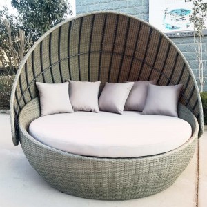 Outdoor round wicker sunbed with canopy