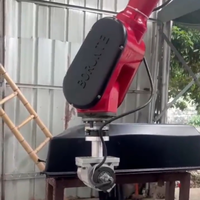 What does industrial robots use to control grip strength?