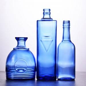 Unique shaped empty blue wine glass bottle