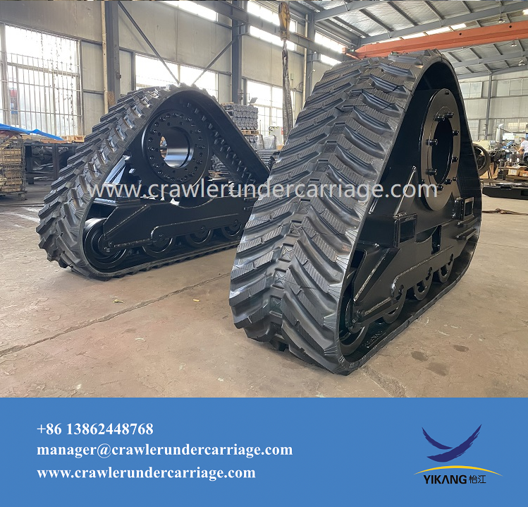 What types of terrain is the rubber crawler undercarriage suitable for?