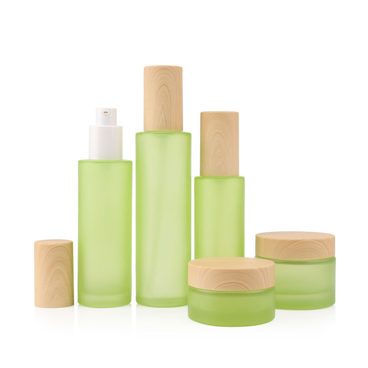 Matte green colored empty glass set skincare bottle packaging
