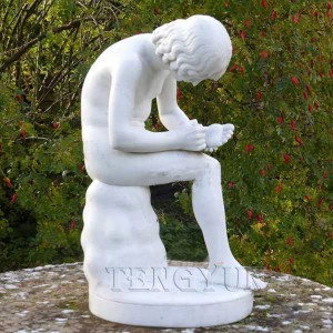 Marble statue boy with thorn