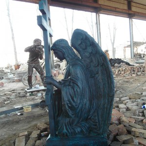 Bronze praying angel with cross