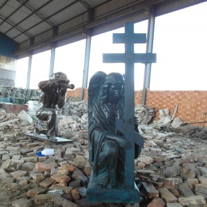 Bronze praying angel with cross