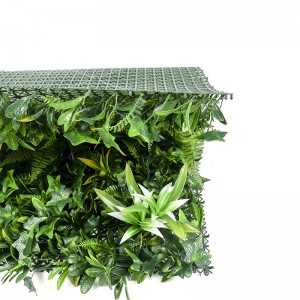 Вештачке биљке на отвореном Лажни зелени панели који покривају украсни зид од траве