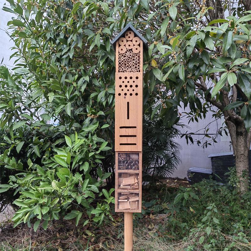 Wooden Insect Hotel With a stick at the bottom