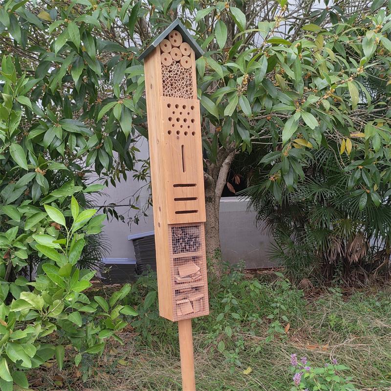 Wooden Insect Hotel With a stick at the bottom