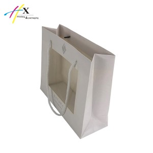 Small white paper bag with clear window