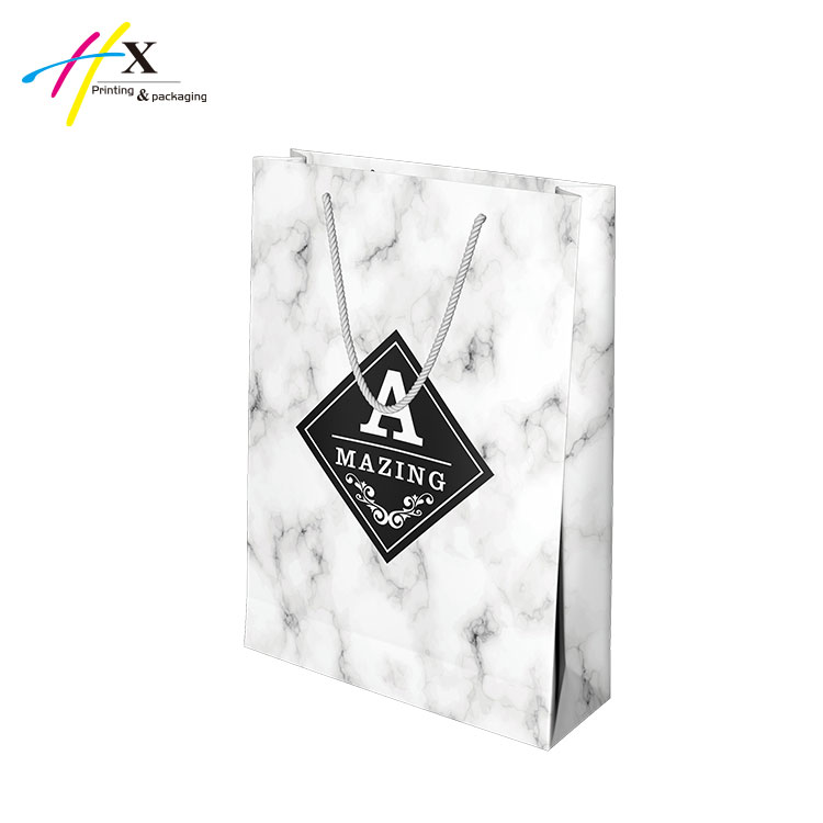Light design printing paper bag with black logo in the middle