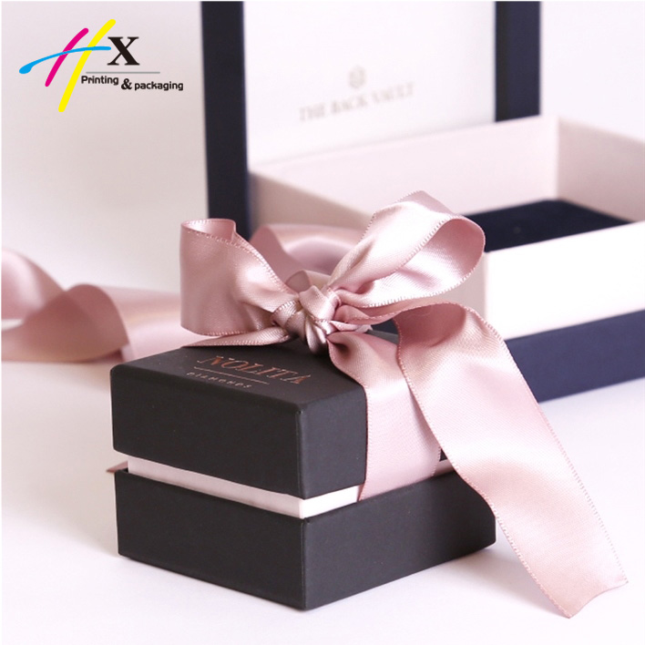 Black nice paper ring box with pink ribbon
