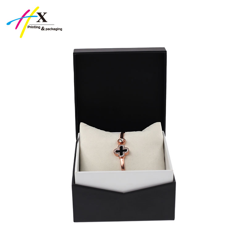 Black paper box with white cushion to pack bangle