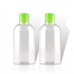 Genomskinlig plast, tomma klämflaskor med grönt skivlock